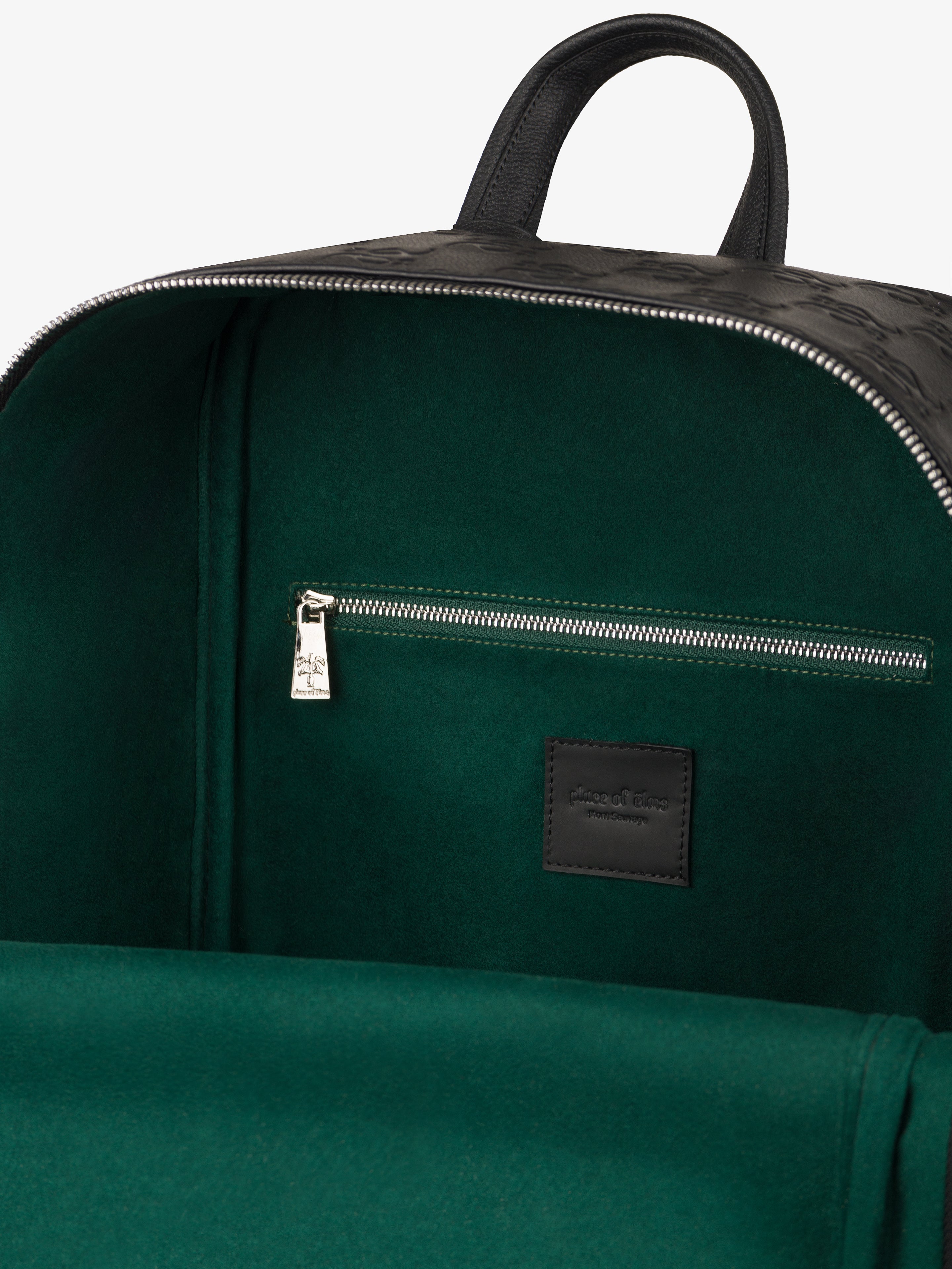 black leather jacket green backpack Place of Elms